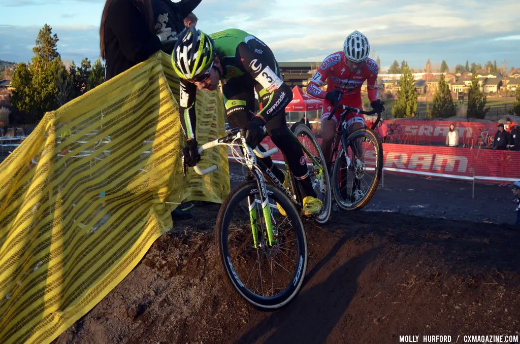Driscoll takes the run-up smoothly while the rider behind him stumbles. © Cyclocross Magazine