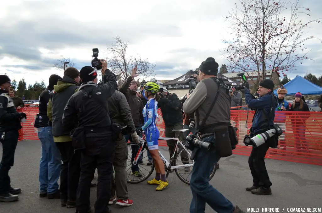 A crew presents a beaming Nash with a birthday cake. © Cyclocross Magazine