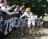 Spectators offering hill climbing incentives to Mo Bruno Roy. © Amy Dykema