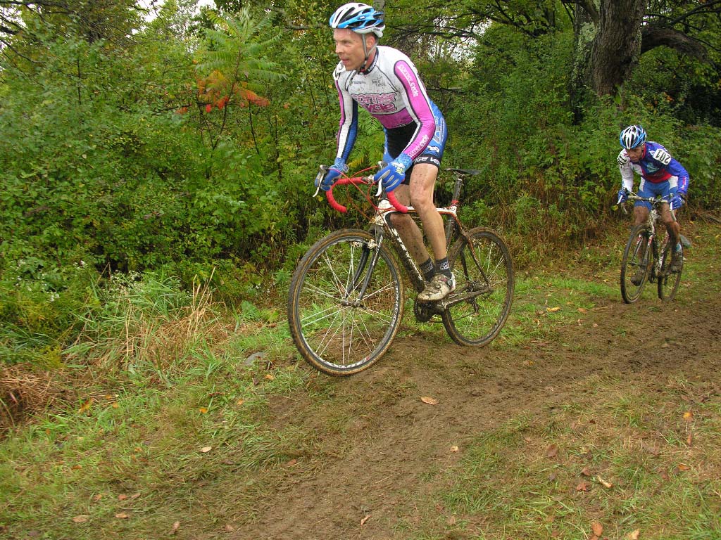 Kevin Hines (Corner Cycle) climbs the mud. by Paul Weiss     