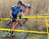 Swiss cyclocross star Valentin Schrez leads Ryan Trebon over the barriers.  ?Anthony Skorochod
