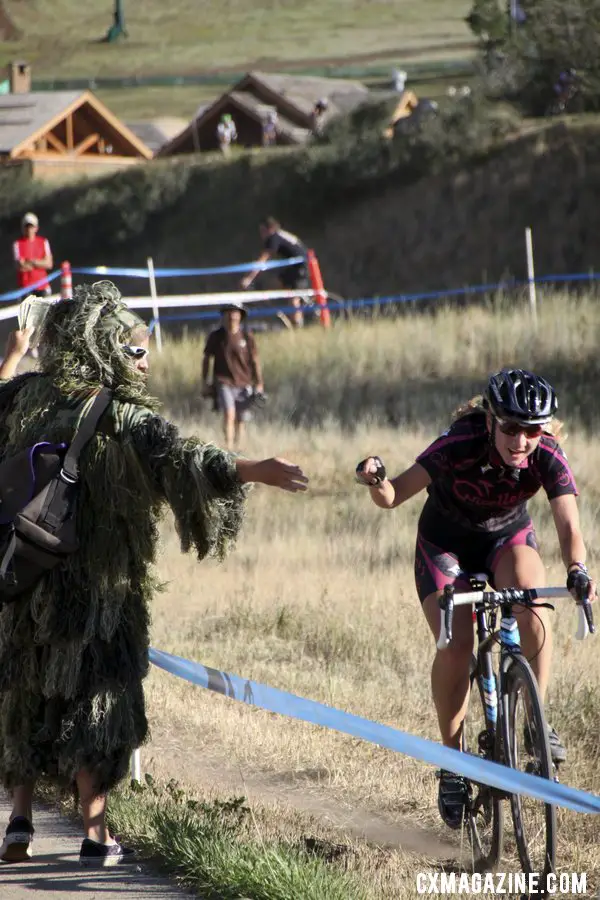 Taking a handup. Women\'s 2012 Raleigh Midsummer Night Cyclocross Race. @Cyclocross Magazine