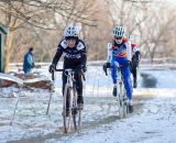 Diane Ostenso (Trek Midwest Team) and Jane Geisse (Spin) in the frigid first race of the day.  Â©Brian Nelson