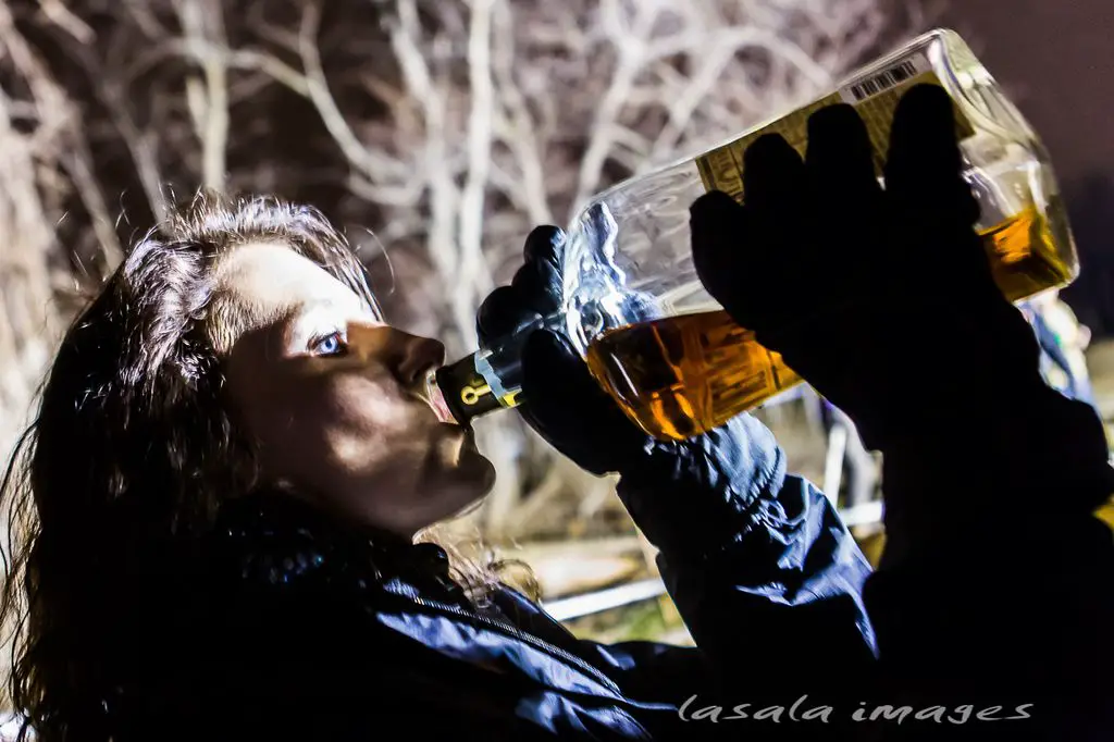 Spectators were more than happy to help drain the bourbon bottles on course. © Matthew Lasala