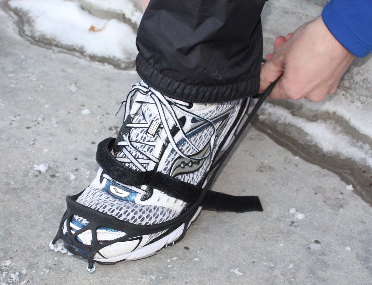 Once the forefoot is secure, stretch the back of the Yaktrax over the heel of your shoe. © Brian Hancock