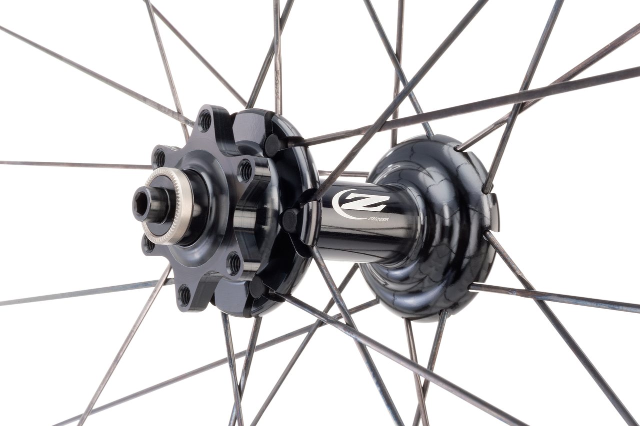 Zipp adds six more spokes to the front wheel to offset braking stresses. photo:Zipp