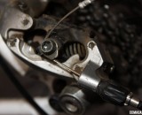 The rear cable clamp on a Rapid Rise rear derailleur to run 9 speeds on a 10 speed Campagnolo lever. © Cyclocross Magazine The rear cable clamp on a Rapid Rise rear derailleur to run 9 speeds on a 10 speed Campagnolo lever. © Cyclocross Magazine