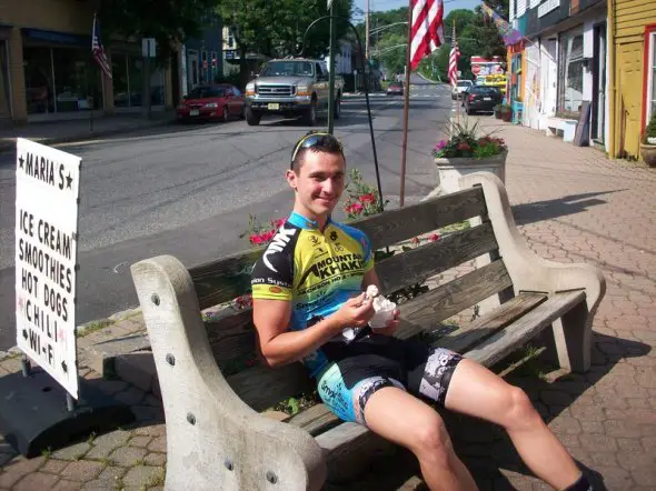 Luke Keough relaxes during a mid-ride ice cream break. © Molly Hurford