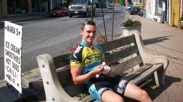 Luke Keough relaxes during a mid-ride ice cream break. © Molly Hurford