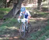 Alex Kim races through the mud. 