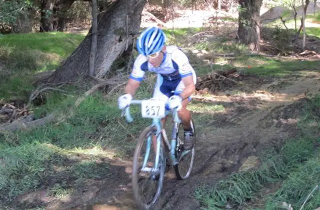 Alex Kim races through the mud.