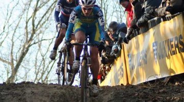 Gabby taking a muddy downhill ahead of an opponent. Photo courtesy of Gabby Day