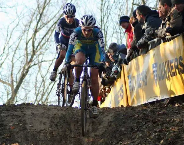 Gabby taking a muddy downhill ahead of an opponent. Photo courtesy of Gabby Day