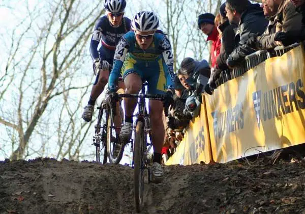 Gabby taking a muddy downhill ahead of an opponent. Photo courtesy of Gabby Day