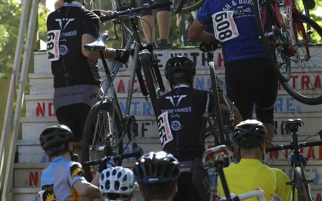 The Cat 4b's take the flyover at the Chicago Cross Cup at Hopkins Park in Dekalb Illinois. Aaron Johnson.