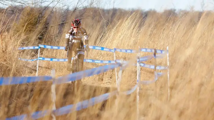 Mellisa Putzer in the tall grass. ©Brian Nelson