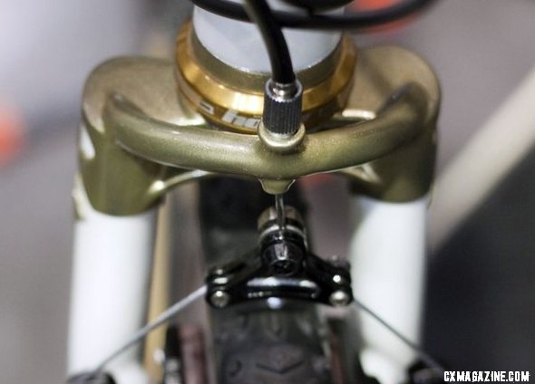 Peacock Groove's Erik Nored modified the fork crown to integrate a cable hanger. NAHBS 2012. ©Cyclocross Magazine Peacock Groove's Erik Nored modified the fork crown to integrate a cable hanger. NAHBS 2012. ©Cyclocross Magazine