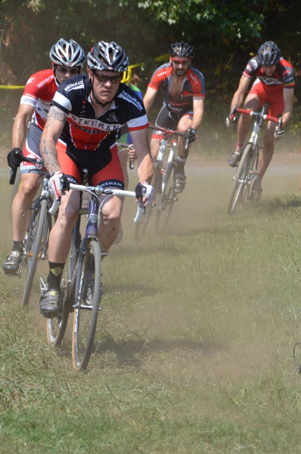 Riders race around the dusty course during hot laps. Trish Albert