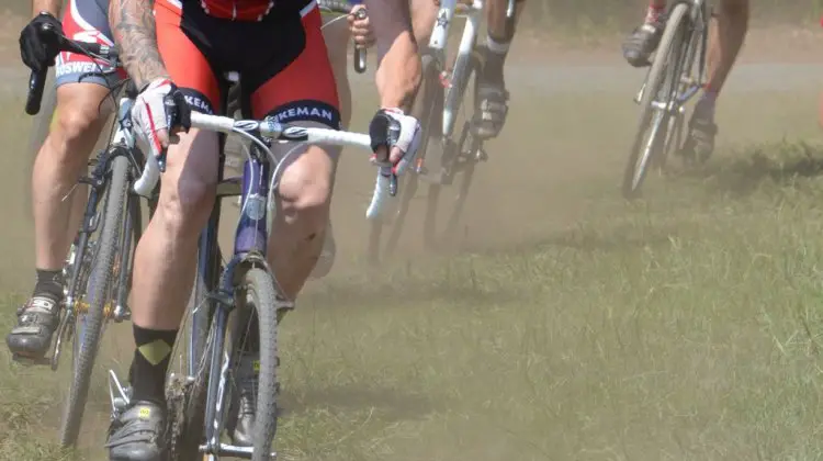 Riders race around the dusty course during hot laps. Trish Albert