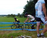 New Rapha-Focus member Gabby Day shows a Hup United rider the best lines for cornering on an off-camber. © Cyclocross Magazine