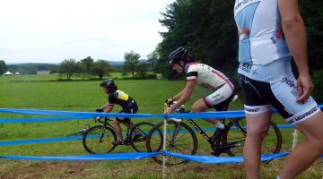 New Rapha-Focus member Gabby Day shows a Hup United rider the best lines for cornering on an off-camber. © Cyclocross Magazine