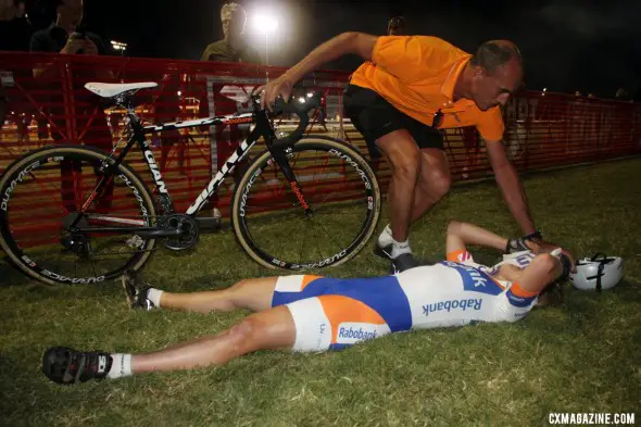 Winner Sanne van Paassen collapse after crossing the line CrossVegas 2012 finish line. ©Cyclocross Magazine