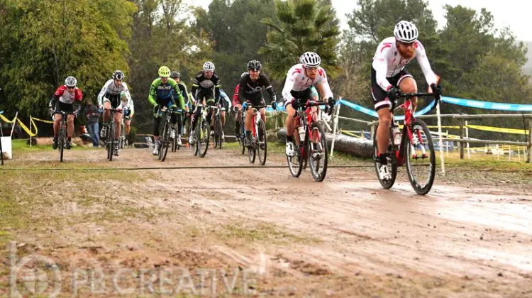 In pouring rain, Brandon “Big Red” Gritters (Rock n’ Road) shoots to an early Men’s A lead. © Phil Beckman