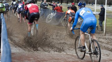 A deep puddle in the starting straight woke up the Masters racers on their first lap. © Cyclocross Magazine