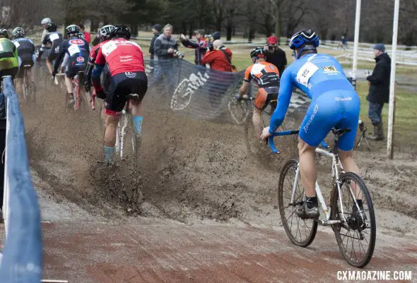 A deep puddle in the starting straight woke up the Masters racers on their first lap. © Cyclocross Magazine
