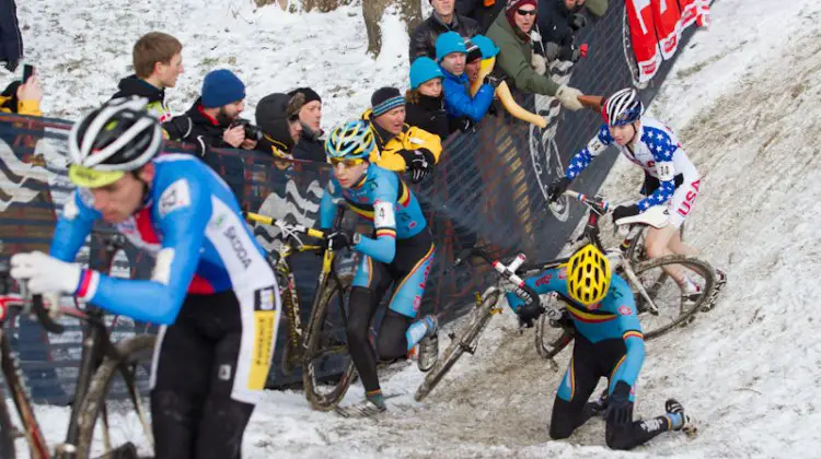 The Belgian rider goes down and Logan Owen chases at the Elite World Championships of Cyclocross 2013. © Brian Nelson