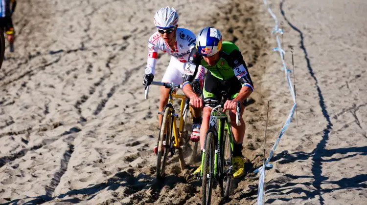 Johnson and Takenouchi in the sand.