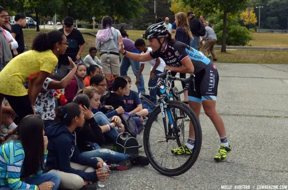 Caroline Mani high fives the crowd. © Cyclocross Magazine