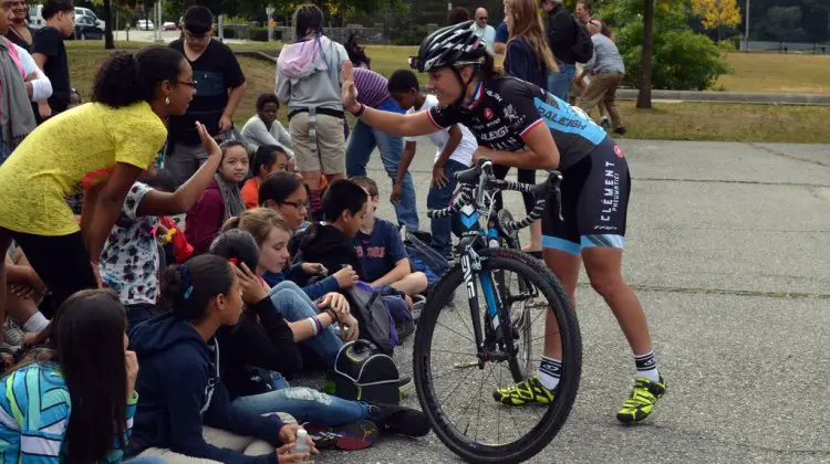 Caroline Mani high fives the crowd. © Cyclocross Magazine