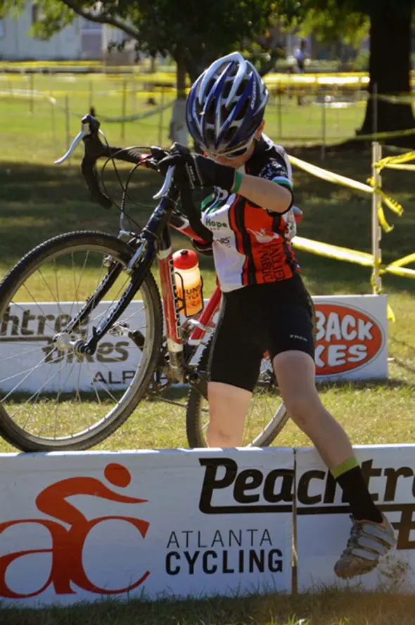 A up-and-coming racer negotiates the barriers. © Trish Albert