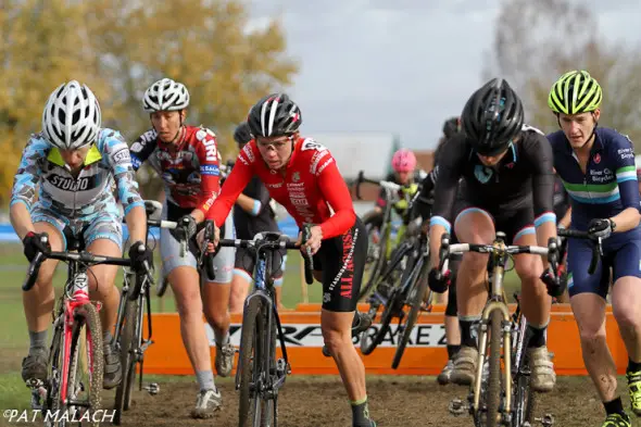 The Women's A field goes over the barriers early on the first lap. © Pat Malach