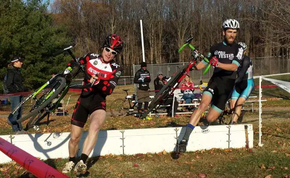 Patrick Blair, left, and Tim Rugg charging over the barriers. © Neil Schirmer