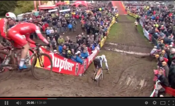 Kevin Pauwels crashes into the fencing at the 2013 Hamme-Zogge Superprestige cyclocross race. 