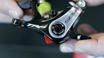 The TRP Brakes' post-recall dual piston Spyre now has two adjustable pads, and clearer adjustment instructions. No more confusing 5mm hex hole to hide the 3mm hex adjustment bolt. - Frost Bike 2014. © Cyclocross Magazine