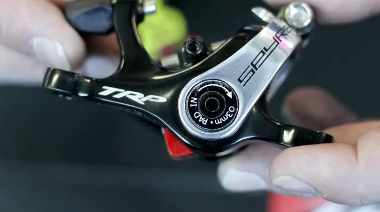 The TRP Brakes' post-recall dual piston Spyre now has two adjustable pads, and clearer adjustment instructions. No more confusing 5mm hex hole to hide the 3mm hex adjustment bolt. - Frost Bike 2014. © Cyclocross Magazine