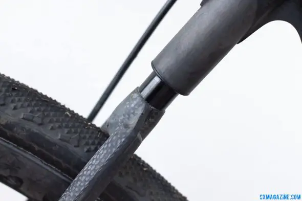 This Calfee Manta CX Prototype has 1.2cm of travel. Tight tire clearance, but a taller, wider wishbone will add mud clearance. © Cyclocross Magazine This Calfee Manta CX Prototype has 1.2cm of travel. Tight tire clearance, but a taller, wider wishbone will add mud clearance. © Cyclocross Magazine