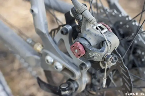 Jesse Reeves' Triton titanium gravel bike has sliding dropouts to go single or geared. A BB7 MTN disc caliper is compatible with his V-brake drop bar brake levers. © Cyclocross Magazine