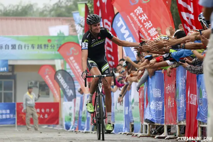 The crowd came out and welcomed racers home. Ryan Trebon, second. 2014 Qiansen Trophy cyclocross race, China. © Cyclocross Magazine