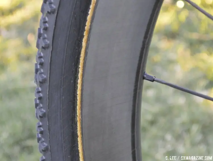 Asymmetrical carbon tubular rims. On the front, the right side is flat, while the left side is offset - almost looking like a brake track. CrossVegas 2014. © Cyclocross Magazine