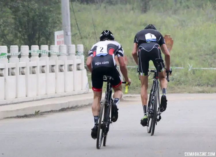 Ryan Trebon and Thijs Al head into the last lap at the 2014 Qiansen Trophy Cyclocross Race in China. © Cyclocross Magazine