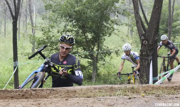 Andrew Reardon climbing the stairs at the 2014 Qiansen Trophy Cyclocross Race. © Cyclocross Magazine