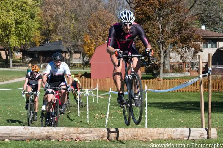 Russ Kuryk (Chicago, IL) leads Gerrit Sinclair (Bloomington, IL) over a log barrier. © SnowyMountain Photography