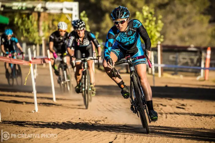 Amanda Nauman (SDG/Bellwether/Krema) squints into the setting sun while taking the early lead in Elite A. © Philip Beckman/PB Creative