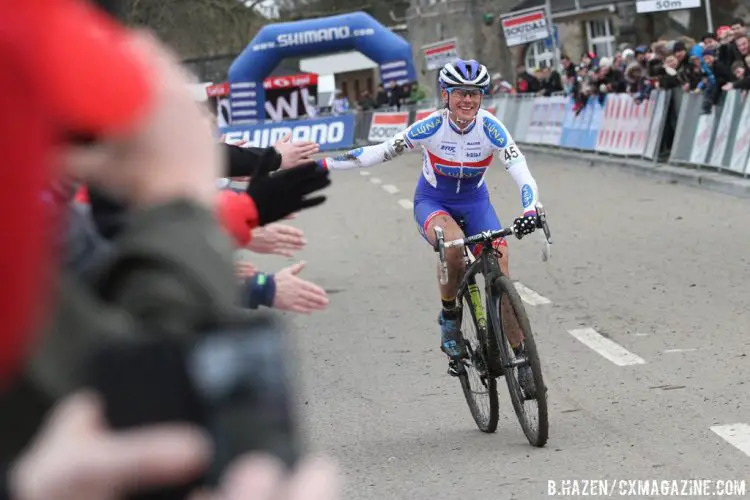 Katerina Nash with her signature hand-slapping at the end of a well-deserved win at Namur. © Bart Hazen/Cyclocross Magazine