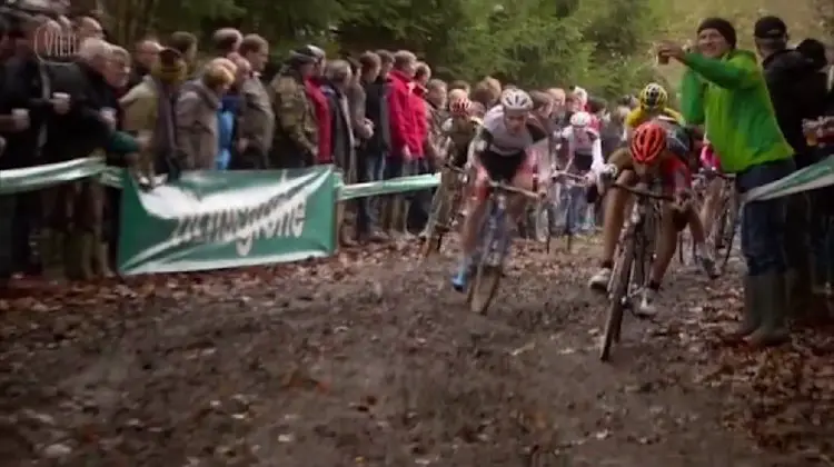 Rob Peeters opting to go beneath man made barriers instead of taking the handup. Photo from Vier/UCI