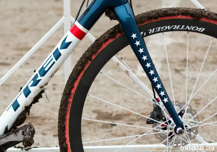 Katie Compton's red, white, and blue bike has 10 stars on the fork leg, one for each National title. There’s room for the new one. © Cyclocross Magazine